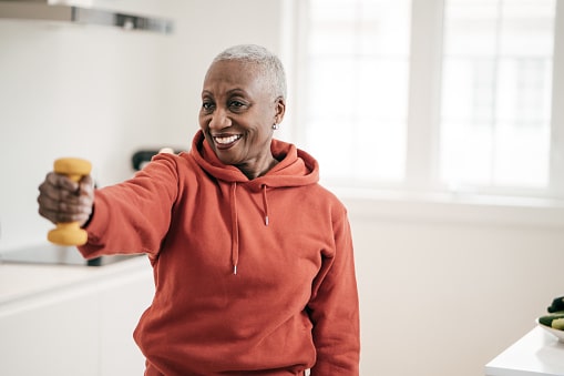 Senior women taking care of herself she exercise with dumbbells