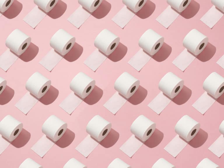 Toilet rolls on pink background