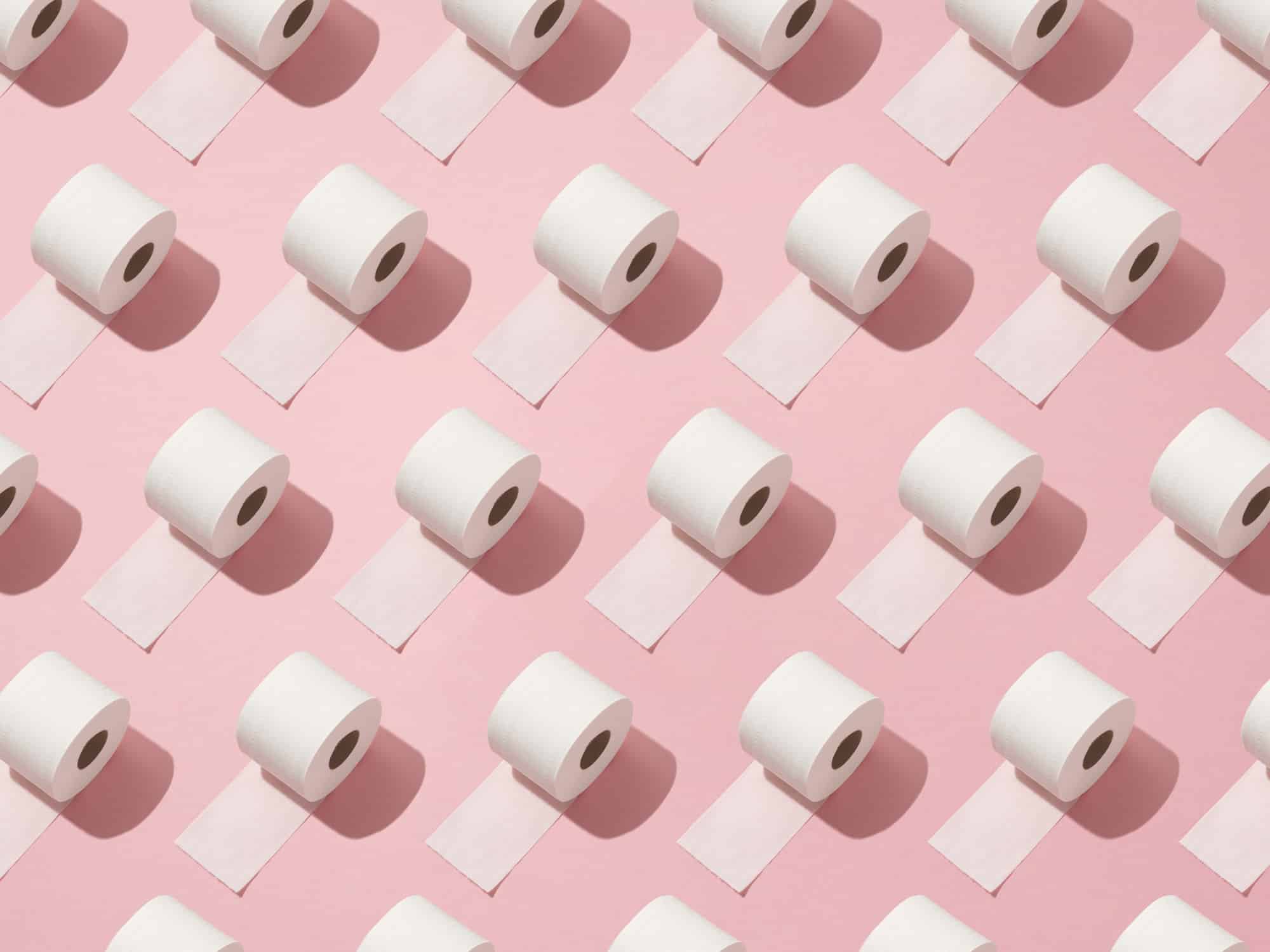 Toilet rolls on pink background