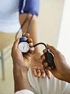 african american getting blood pressure checked