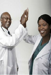 male and female doctor giving a high five to each other