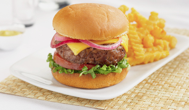 A hamburger and fries on a white plate