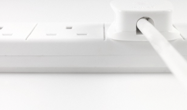 A charger plug attached to an electrical socket