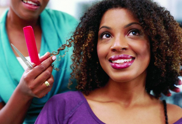 A smiling woman at the hair salon