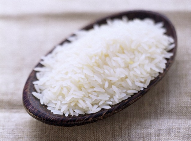 A wooden bowl filled with rice