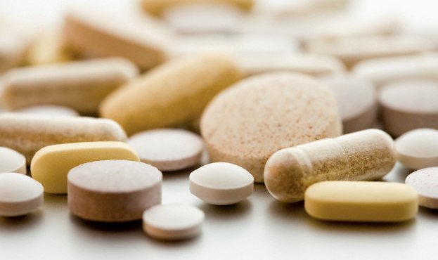 A pile of different types of vitamins