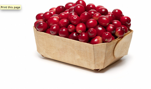 A wooden basket of cranberries
