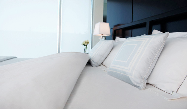 A clean hotel room bed