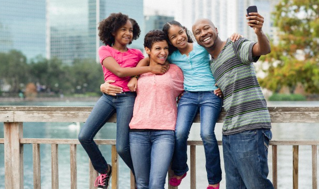 father-taking-photo-of-family