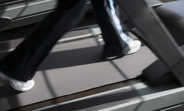 A woman walking on a treadmill