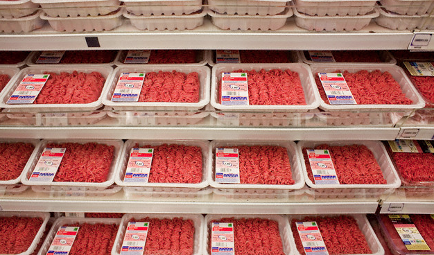 packages of ground beef in a grocery store