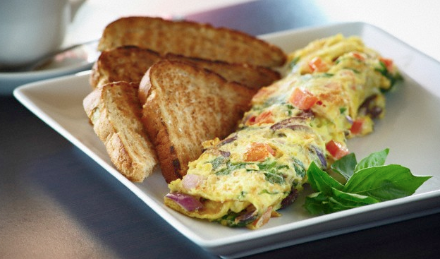 A veggie omelette with a side of toast