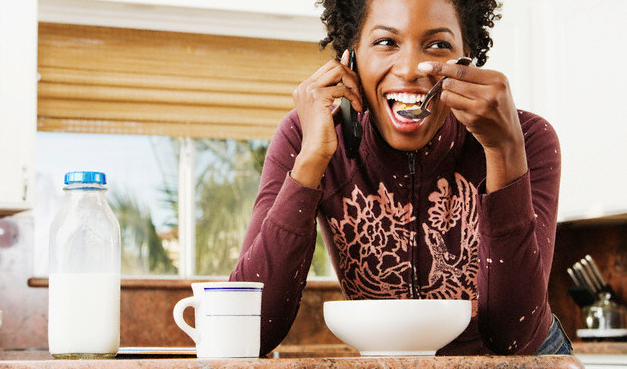 A woman eating breakfast cereal