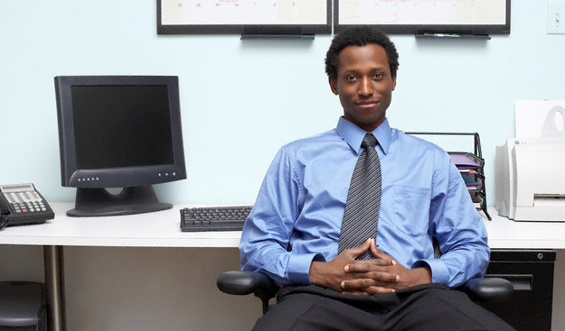 A man sitting at his desk