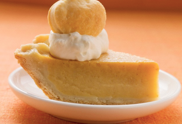 A slice of pumpkin pie on a plate