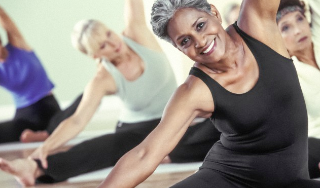 A woman taking a yoga class