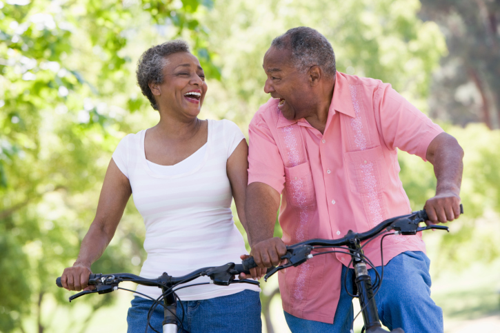 senior couple riding a bike