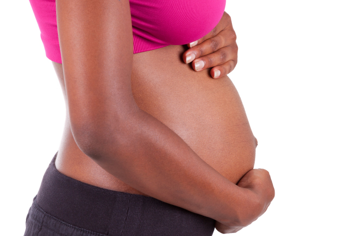 young woman holding her stomach