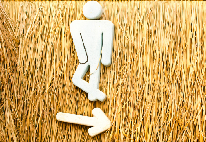 public bathroom sign, with leg crossed