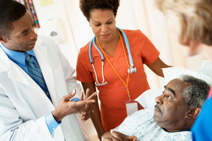 doctor talking to patient in hospital