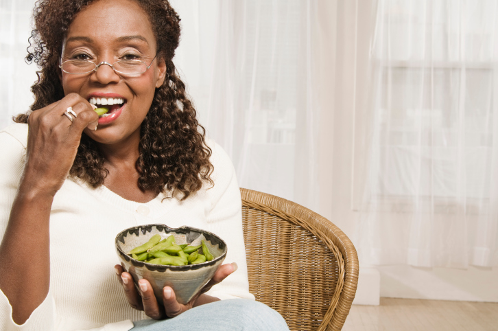 woman eating edamame