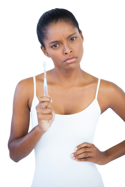 woman holding toothbrush