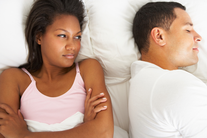 couple in bed with issues
