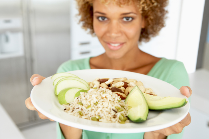 woman with plate of healthy food