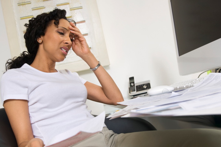 worried woman doing finances