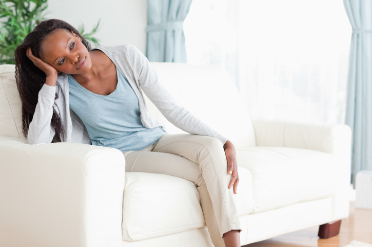 woman deep thought couch