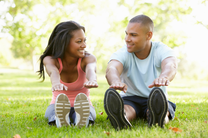 young african american couple exercising in the park