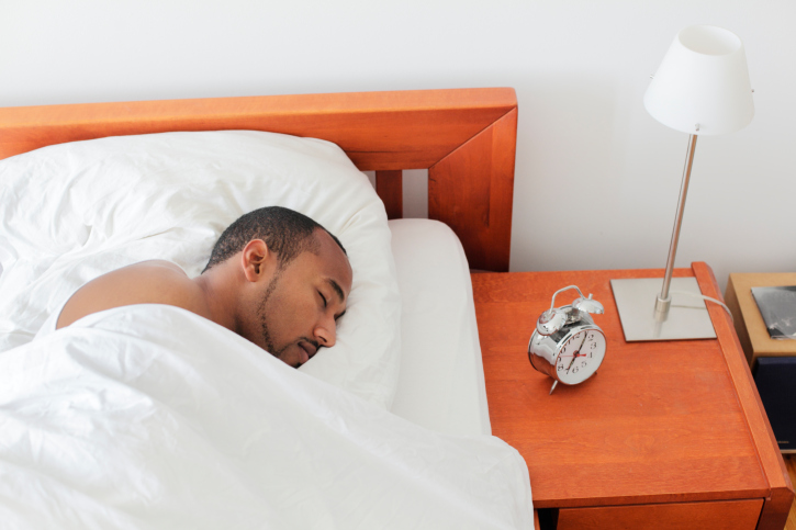 man sleeping in bed morning