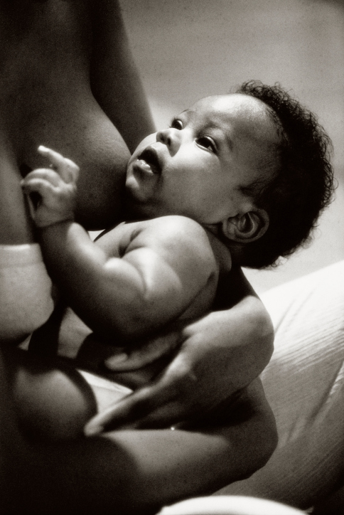 African American mother breastfeeding her baby boy