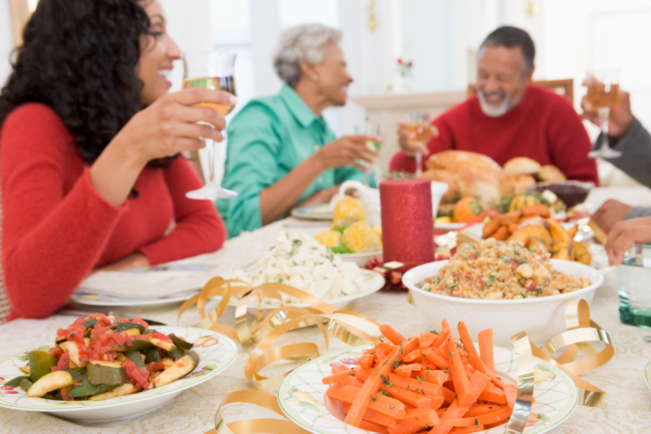 african american family sitting at a holiday dinner table