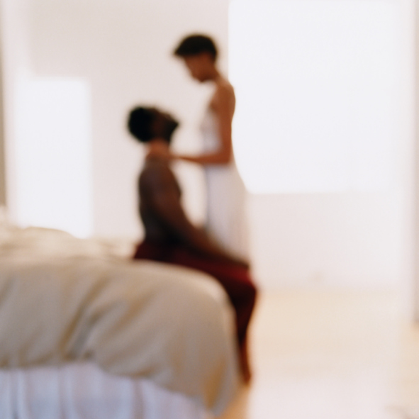 couple in bedroom unfocused