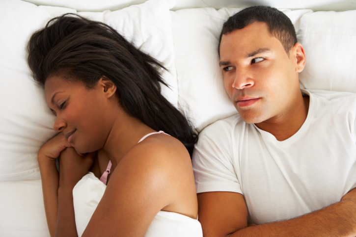 couple bed man upset