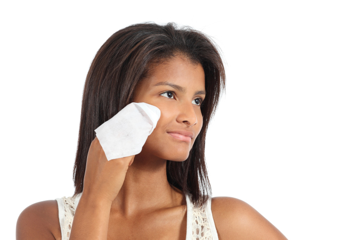 woman removing makeup