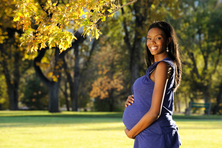 pregant woman posing outside