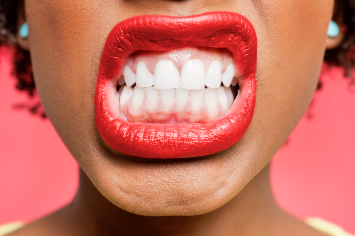 woman clenching teeth