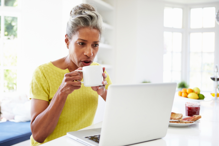 older woman coffee laptop
