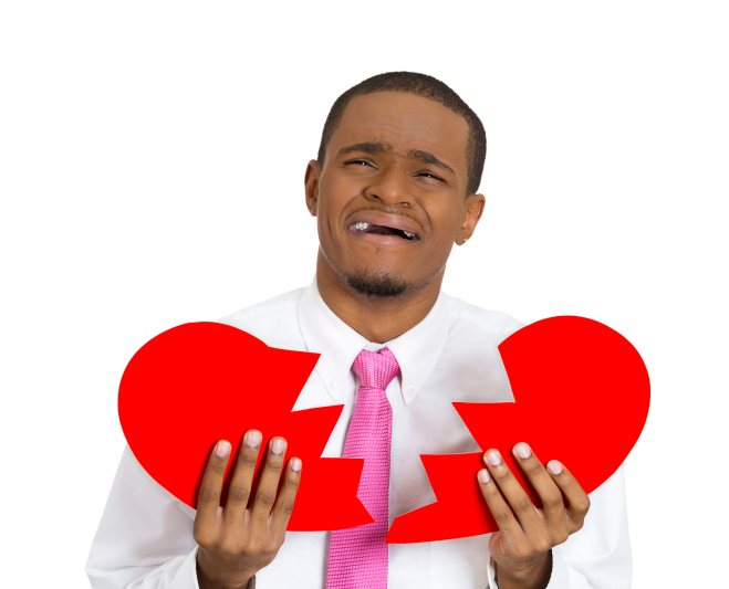 african american man holding broken heart