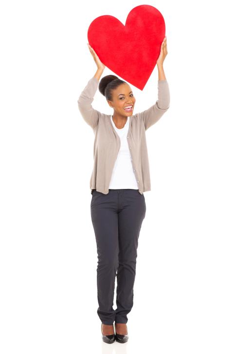 african american woman holding heart shape