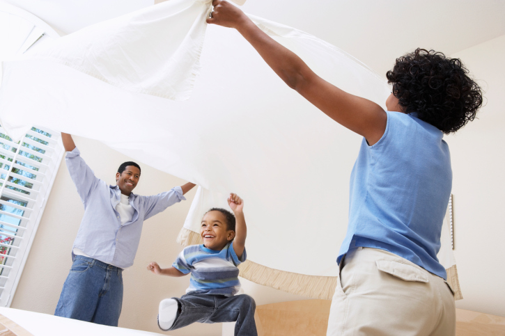 family making up bed