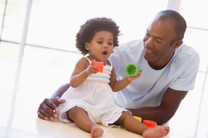 father and baby girl playing