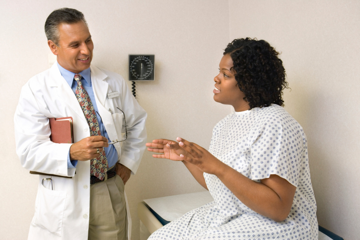 woman talking to doctor
