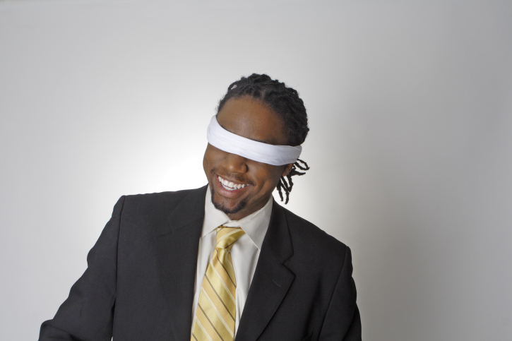 smiling blindfolded african american businessman