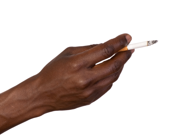 black hand holding a lit cigarette