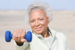 senior woman with dumbbell