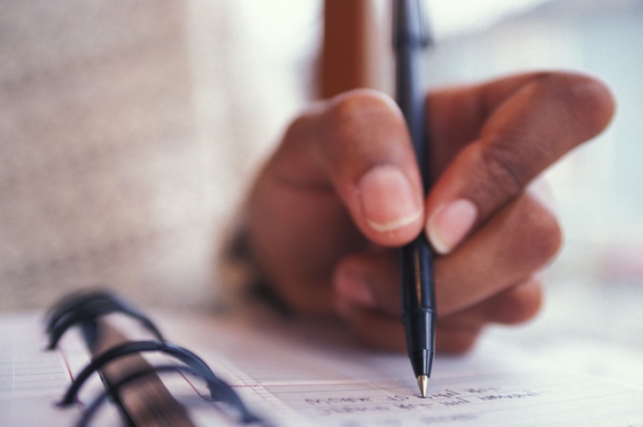 woman writing down 