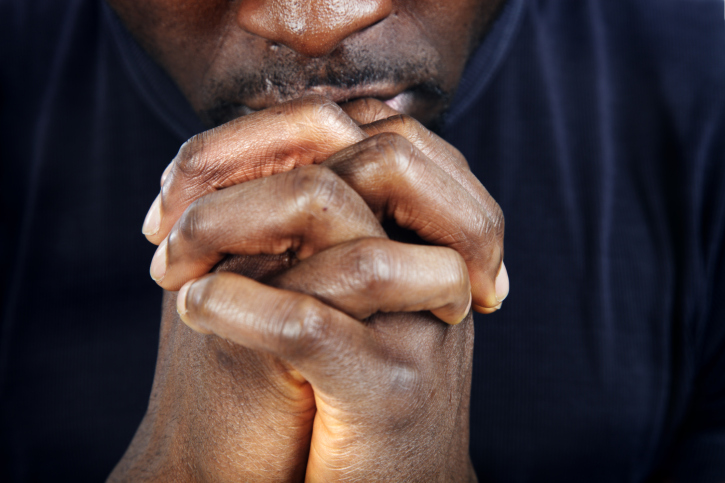 man in prayer close up